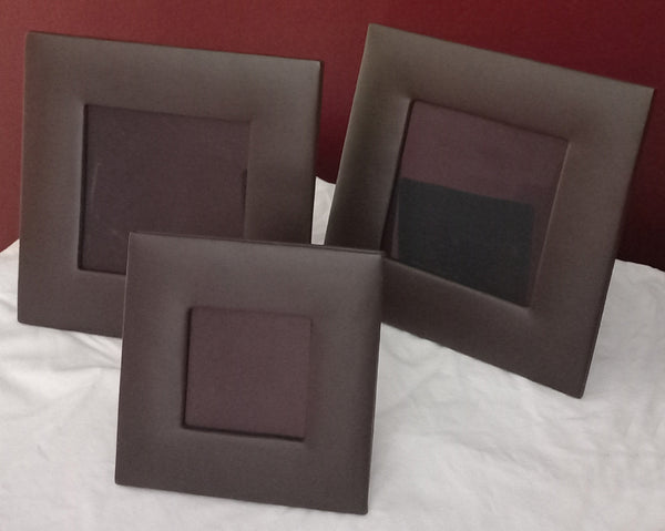 Three leather picture frames (boxed)