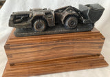 Stone Carved Vehicle on Wooden Plinth