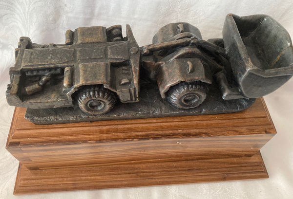 Stone Carved Vehicle on Wooden Plinth