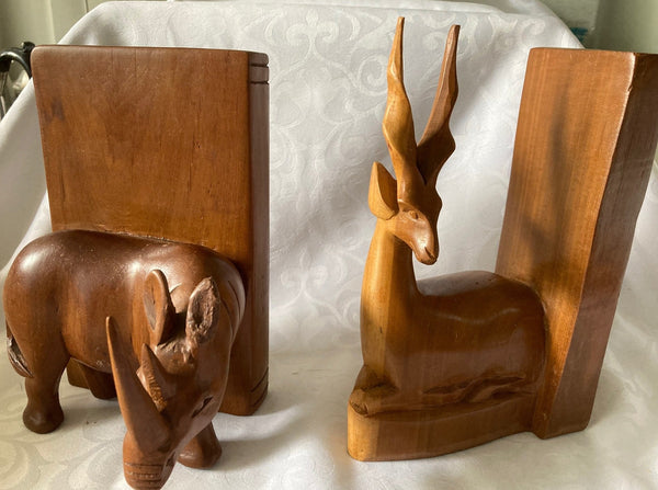 Wood Carved Bookends (not matching). Tiny chip on Rhino